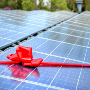 A solar panel adorned with a ribbon in the color red.